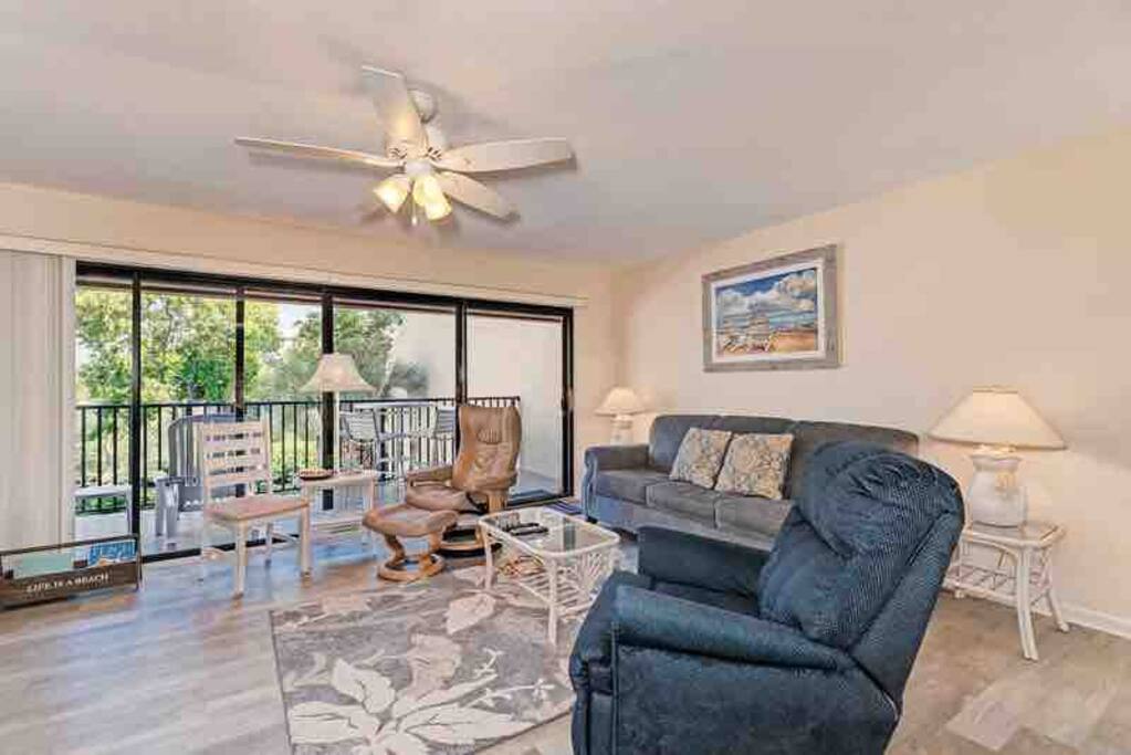 Living room with new queen memory foam sleeper sofa and recliner