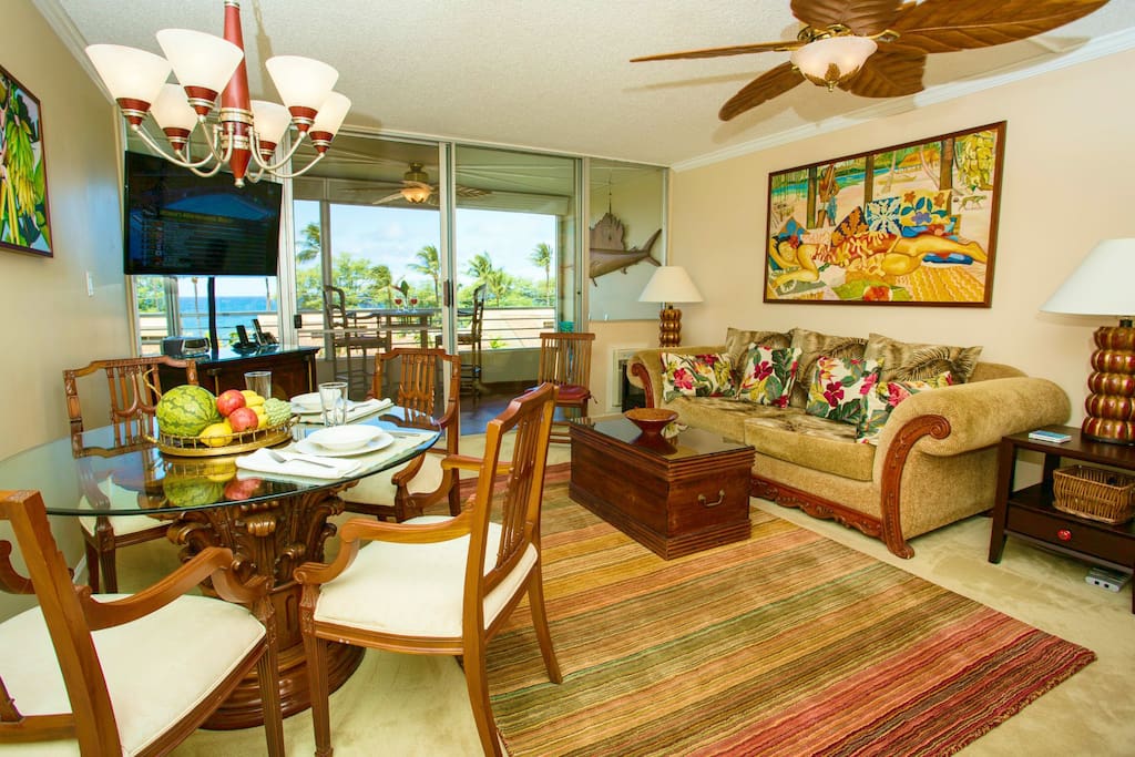 View of of the ocean and swaying palms are visible even from inside the condo