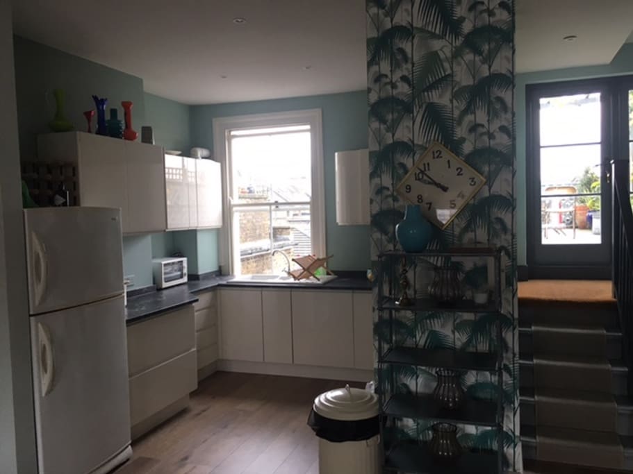 Kitchen with integrated dish/ washing machine