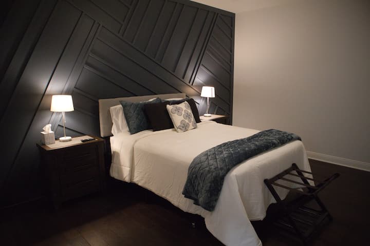 Queen size beds with comfy bedding to comfort you during your stay!  Phone charge ports located in all nightstands.