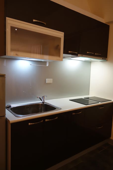 Newly furnished kitchen with dish dryer.elec stove, fridge and utensil.
