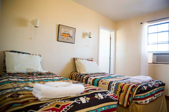 Room 5 with 2 twin beds and a private bathroom