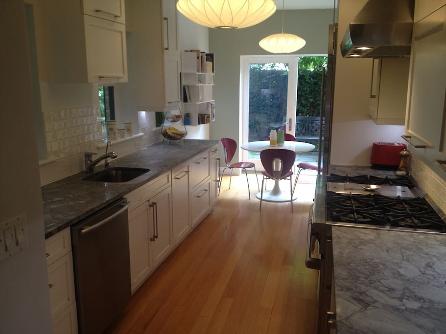 Kitchen features Wolf range and Subzero fridge, Miele dishwasher and lots of counter space.