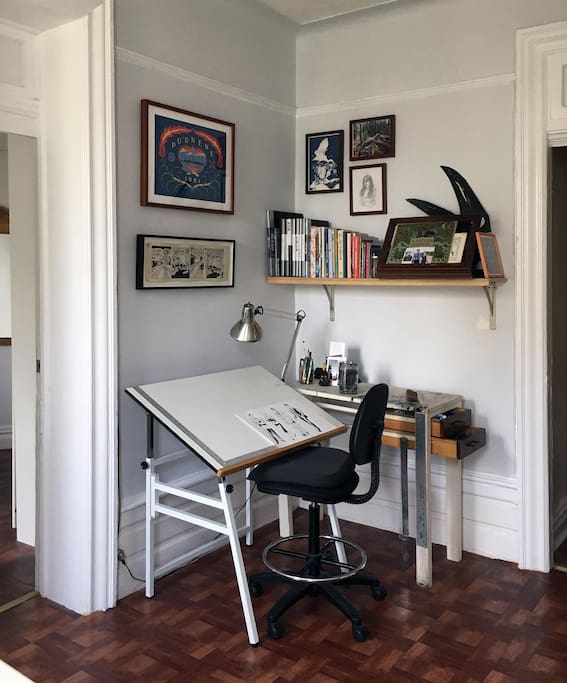 The living room is my work studio. The desk will be collapsed and put away when you arrive, but you're more than welcome to use it if needed!
