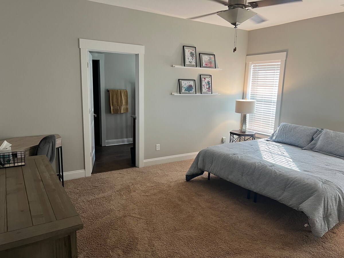 Main bedroom; king size bed, television, desk space, ceiling fan, full bathroom and walk-in closet attached. 