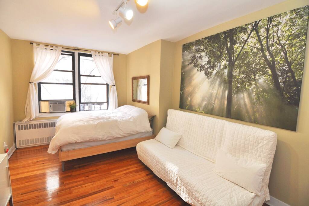In addition to the queen size bed,
the large futon couch can also be converted to a bed.