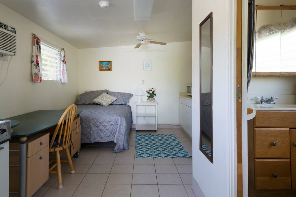 full size bed, desk, ceiling fan