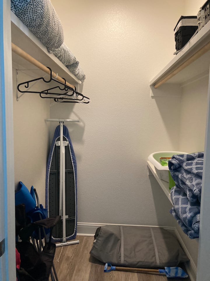 Walk-in closet with master bathroom 