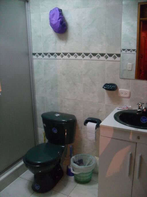 Private bathroom with hot shower and towels