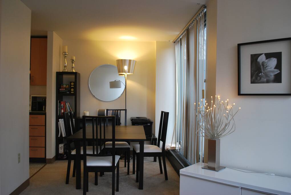 Dining room table extends to fit 8-10 people (we have extra chairs). Doors on the right go out to balcony.