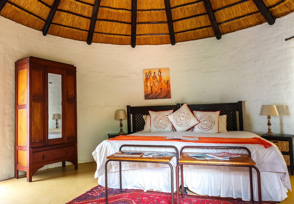 Hornbill Rondavel with Pvt Half bathroom. Has choice of King or 2 singles and an extra single bed.