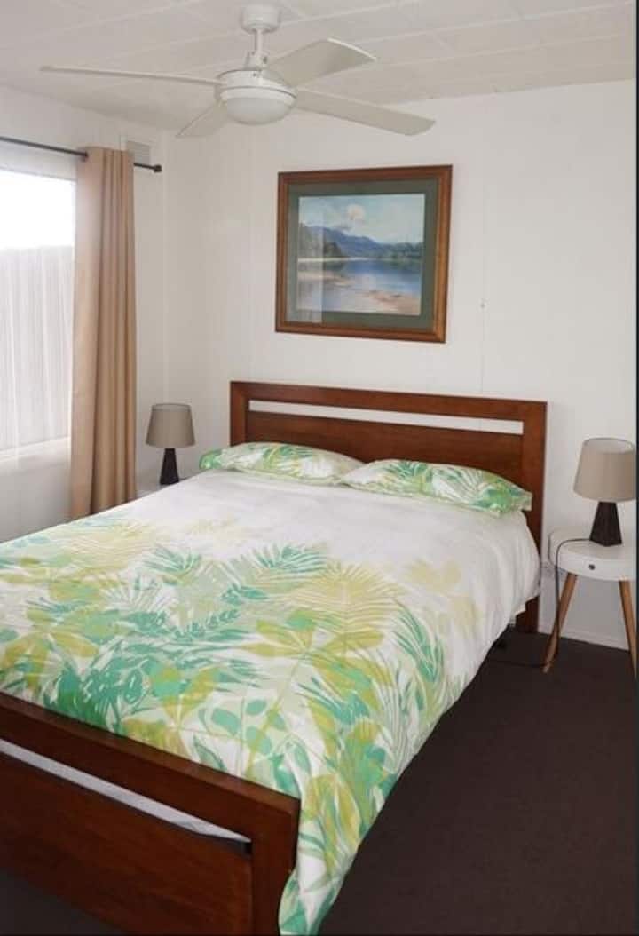 Upstairs queen bedroom with Lake Victoria views.