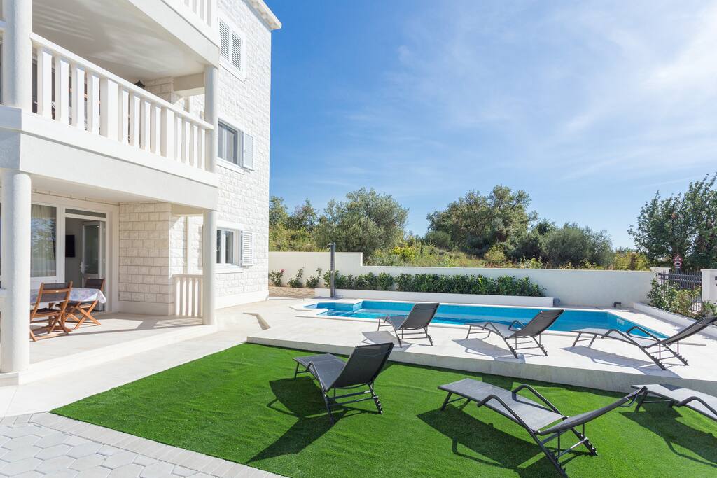 Pool and grassed area