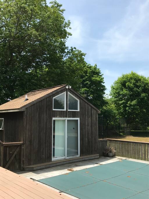 Pool House overlooking the pool has an outdoor shower & half bath!
