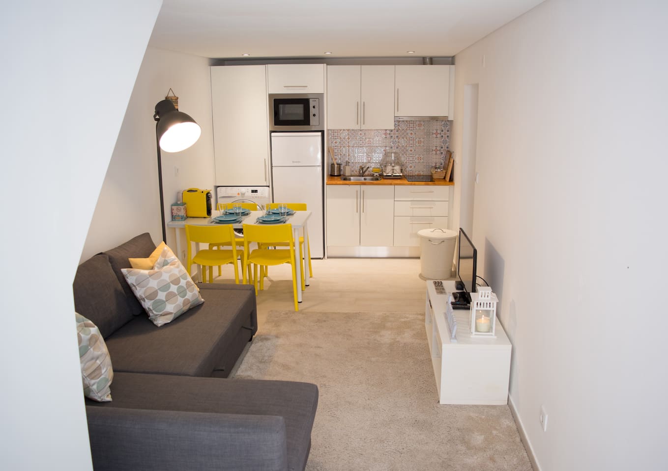 Living Room with Sofabed and Kitchen