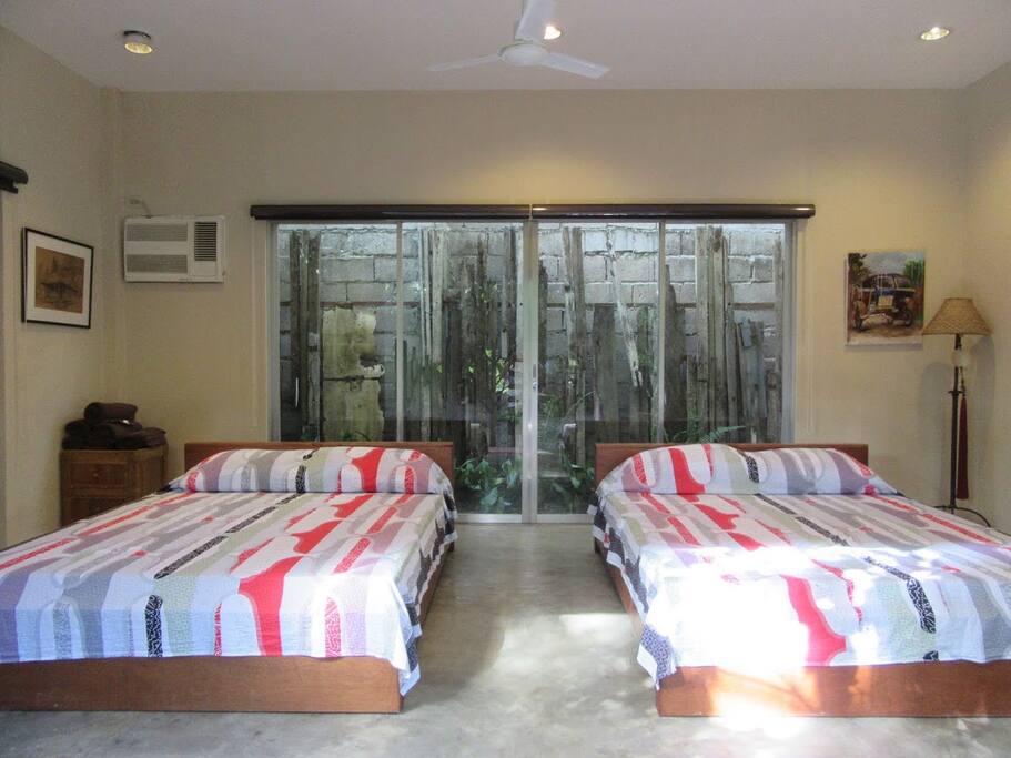 Each room has 2 queen-sized beds with its own toilet and bath.