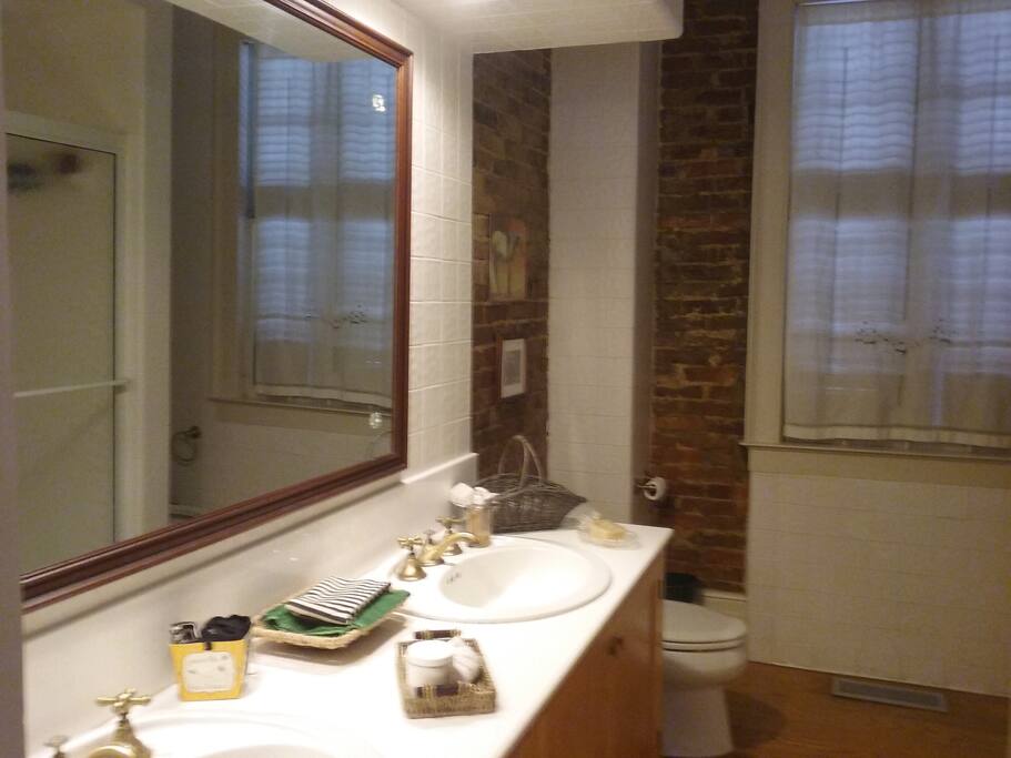 Main floor bathroom, double vanity sinks and full shower