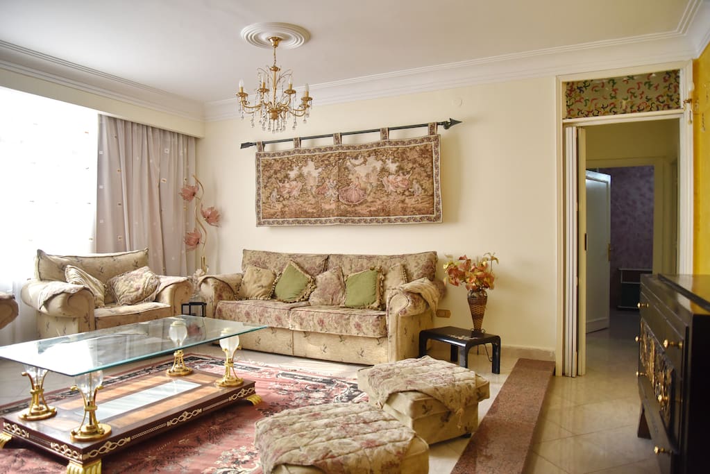 Living room: newly furnished living room with big seating area, LCD TV, air conditioned