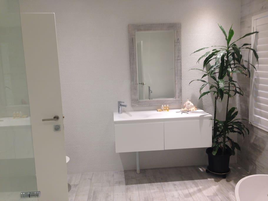 full bathroom ensuite with stone bath and separate shower recess