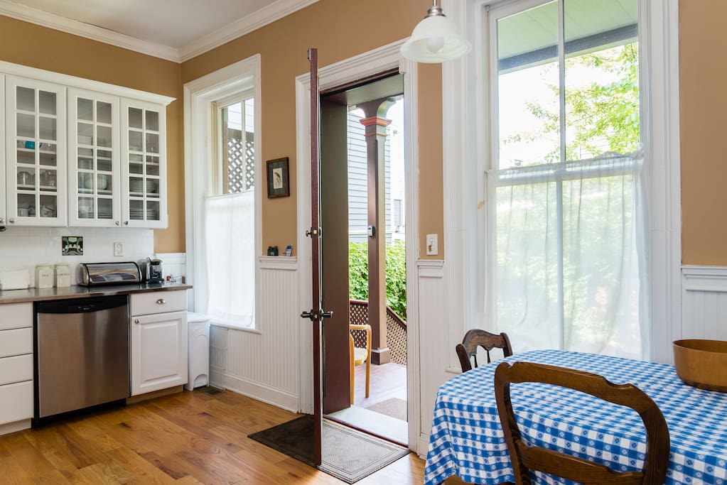 Newly renovated fully equipped kitchen with door leading to back porch and garden.