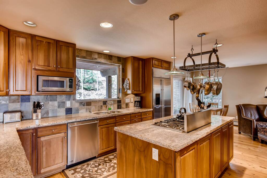 Granite counters and stainless appliances (including dishwasher) in the full kitchen