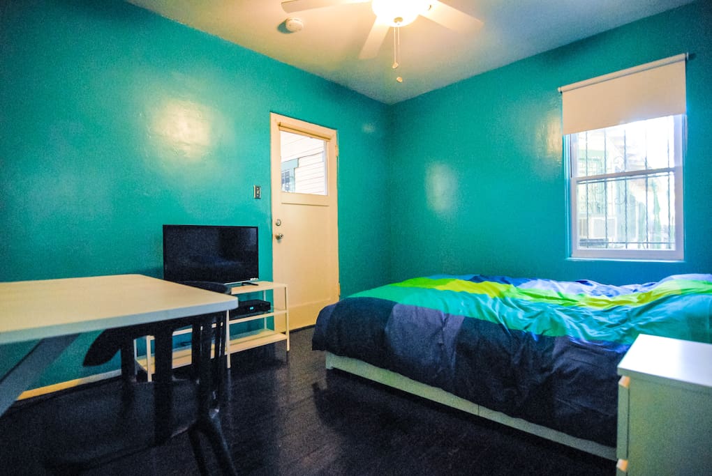 This is the bedroom, it has a closet and cabinets under the bed to put your clothes away, a nightstand, Cable TV, and a fold out desk.