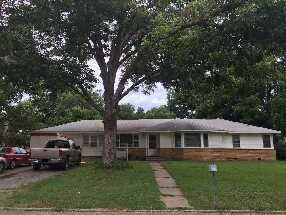 The front of the house with the beautiful, big pecan tree in the yard.