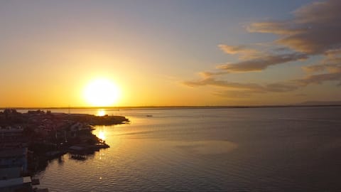 Successful Airbnb property: Unforgettable sunset on the edge of the pond!!! in Tramandaí
