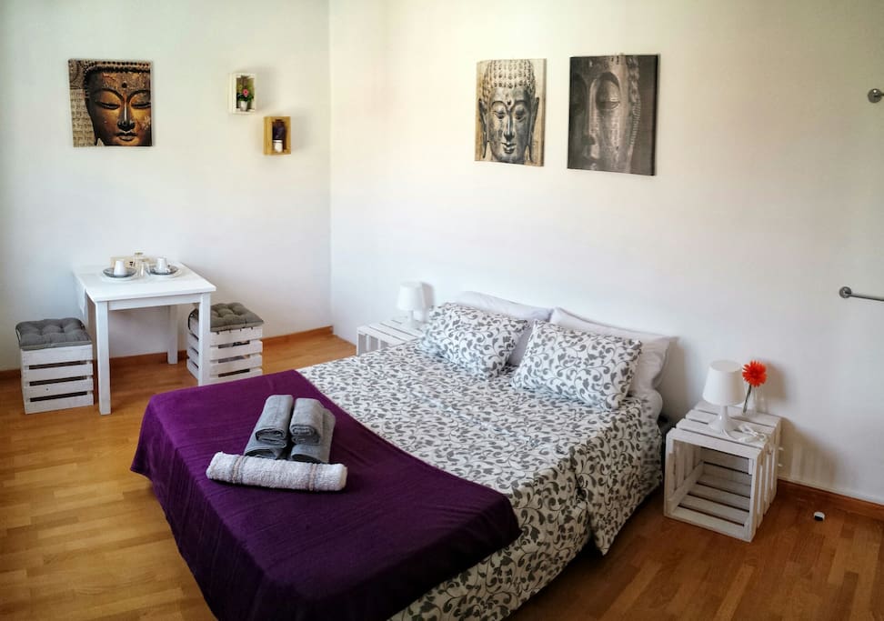 Large room with mattress and viscoelastic pillows