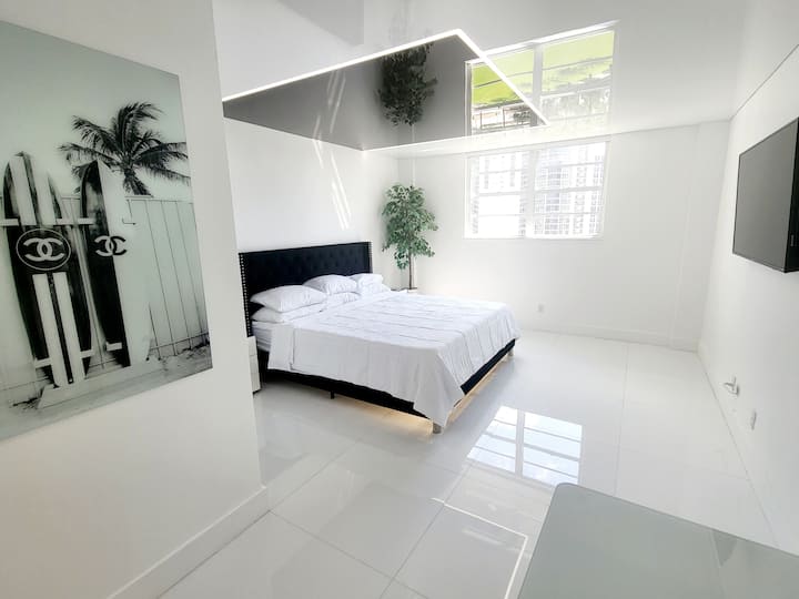 A king bed with cooling memory foam mattress which faces the Smart TV is the center-point of the primary bedroom. Ocean and city light views can be seen from the window. Total blackout shade is installed for sleeping in.