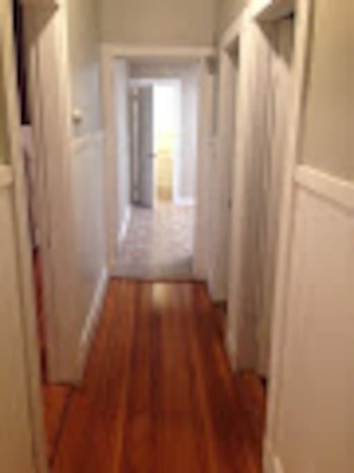 Welcome! The bedroom is through the entrance way on the left and find the doorway off of the living room