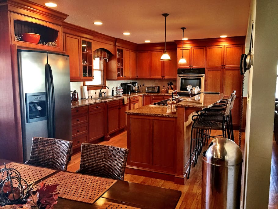 Cherry kitchen with granite counter tops.