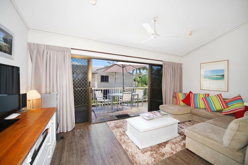 Living room with large balcony with Noosa river views.