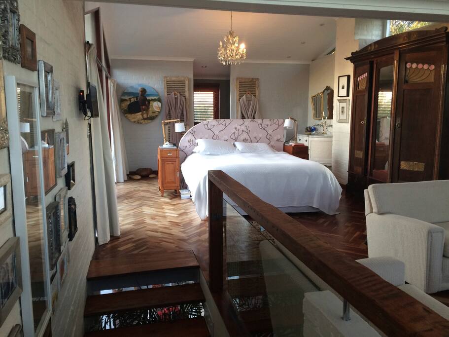 View walking up the stairs to the main bedroom