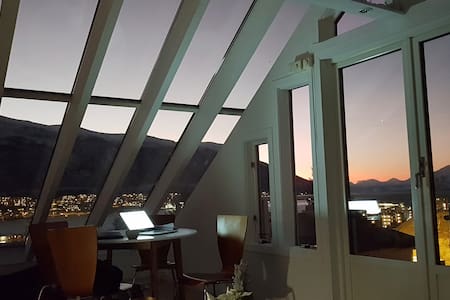 Panoramic glass ceiling loft