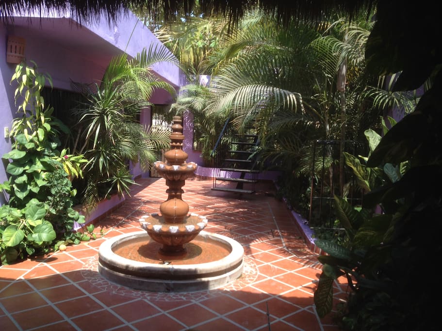 Shared Courtyard - with entrance to property behind the fountain.