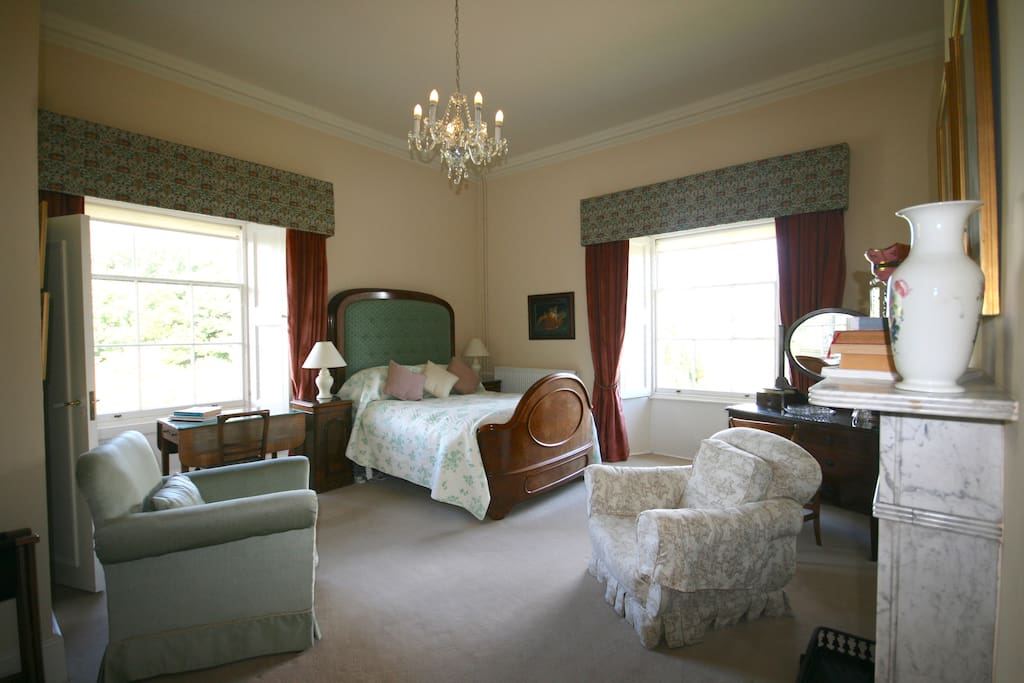 The pink bedroom with dual aspect windows