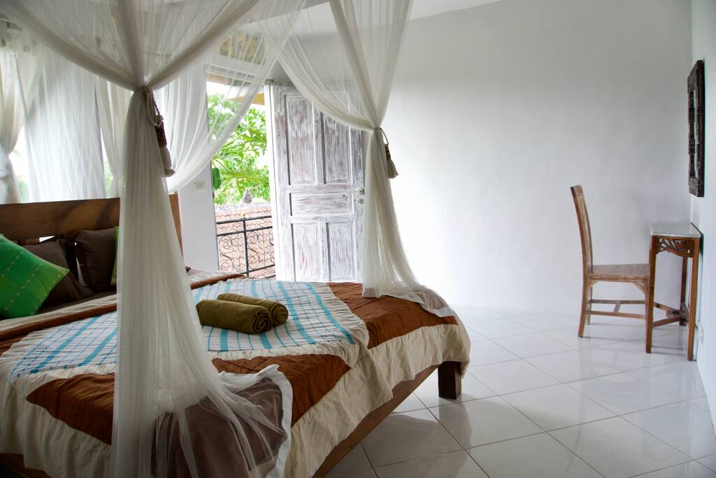 Simple and bright room with fan and private bathroom