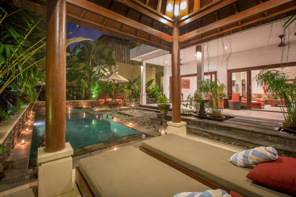 Sun loungers in front of the pool