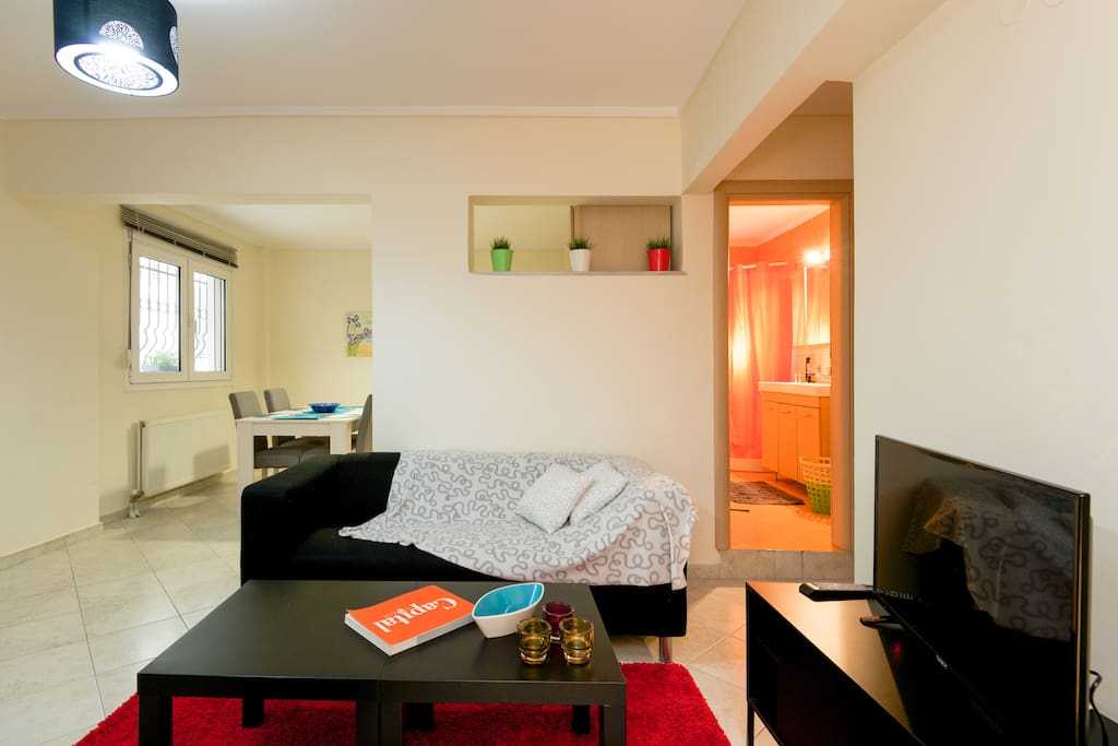 Living area, open plan kitchen and bathroom