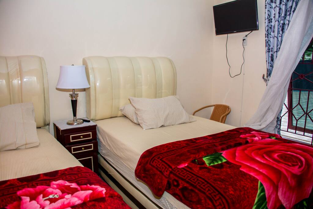 Twin bed room with shared bathroom