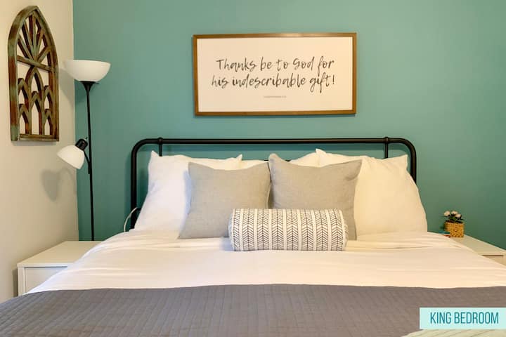The king bedroom offers a new bed, luxurious sheets, a comforter with duvet and/or coverlet. The room also has a ceiling fan, outlets, and a USB charging station.

We also provide plenty of closet space and hangers, dresser drawers, and desk fan. 