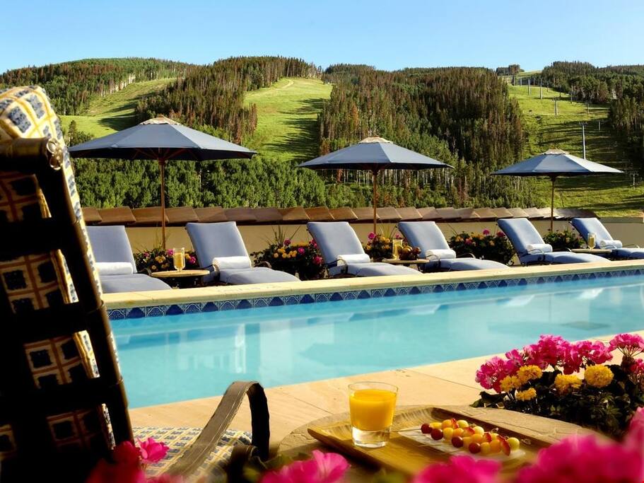 Relax by the rooftop pool with mountain views