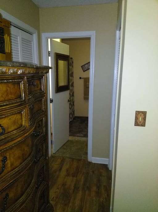 Master bedroom with king size bed with full size bathrom w/closets in bedroom and bathroom.