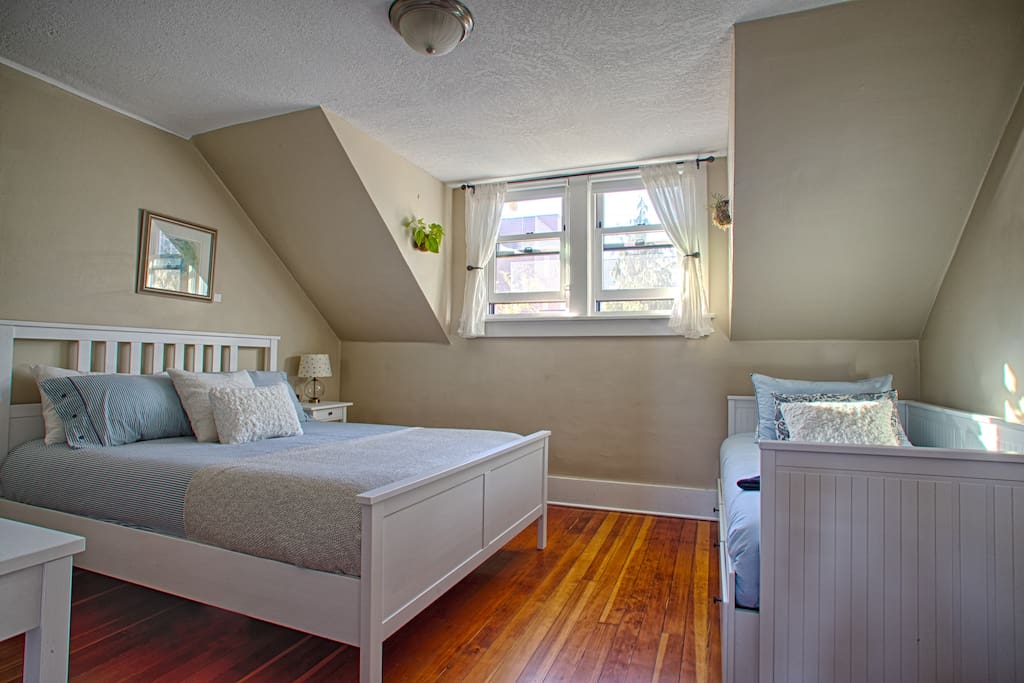 Another view of queen and twin beds