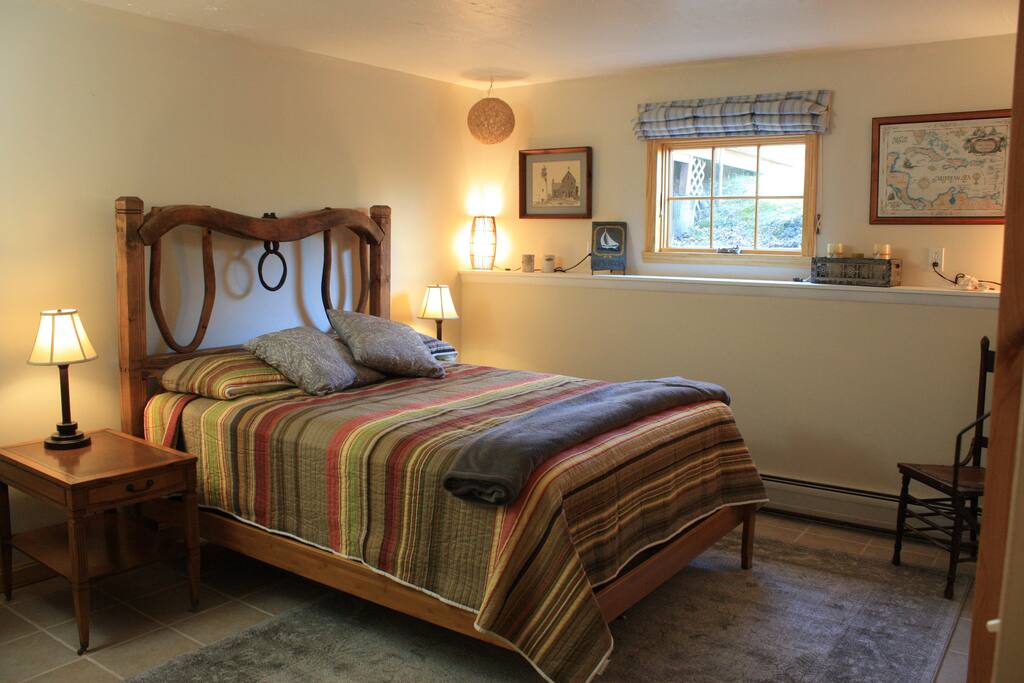 Queen bed in largest bedroom, looking out on the back gardens.