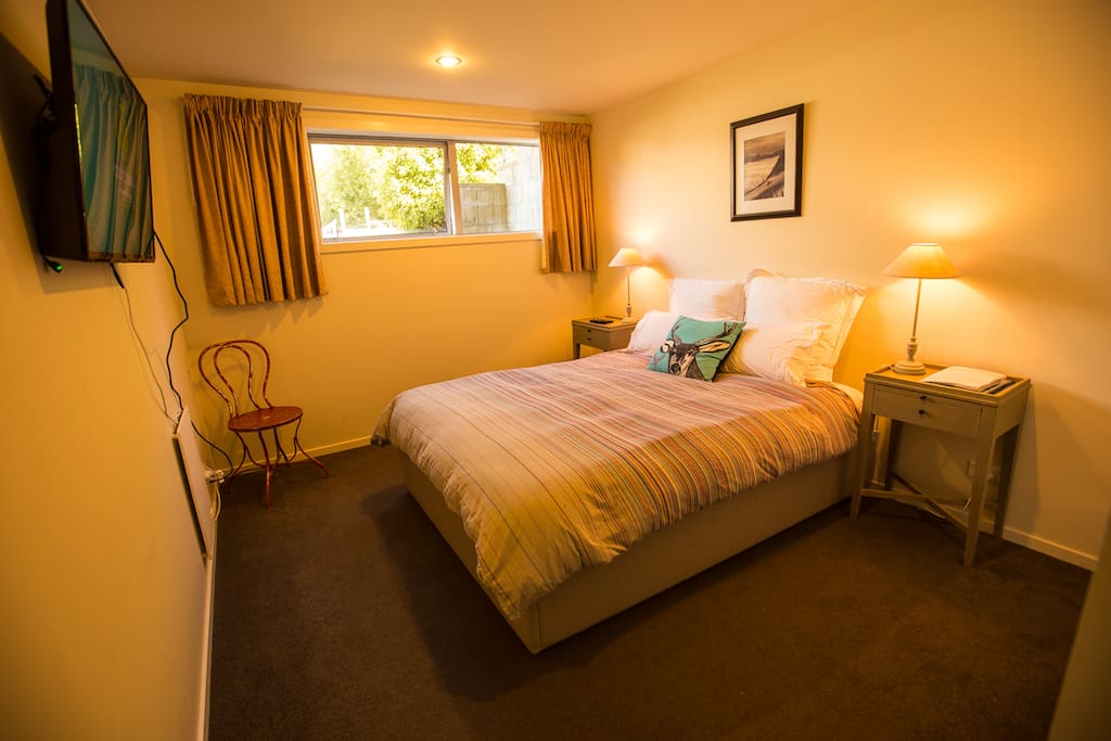 Queen bedroom with plenty of storage space, flat screen TV and a super comfy bed.