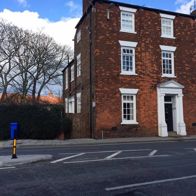 Front elevation showing side entrance gate to private front door