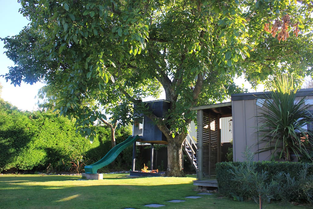 Beautiful back garden, private and secluded, great for kids and adults to unwind. You can also see here the Walnut tree the cottage was named after.