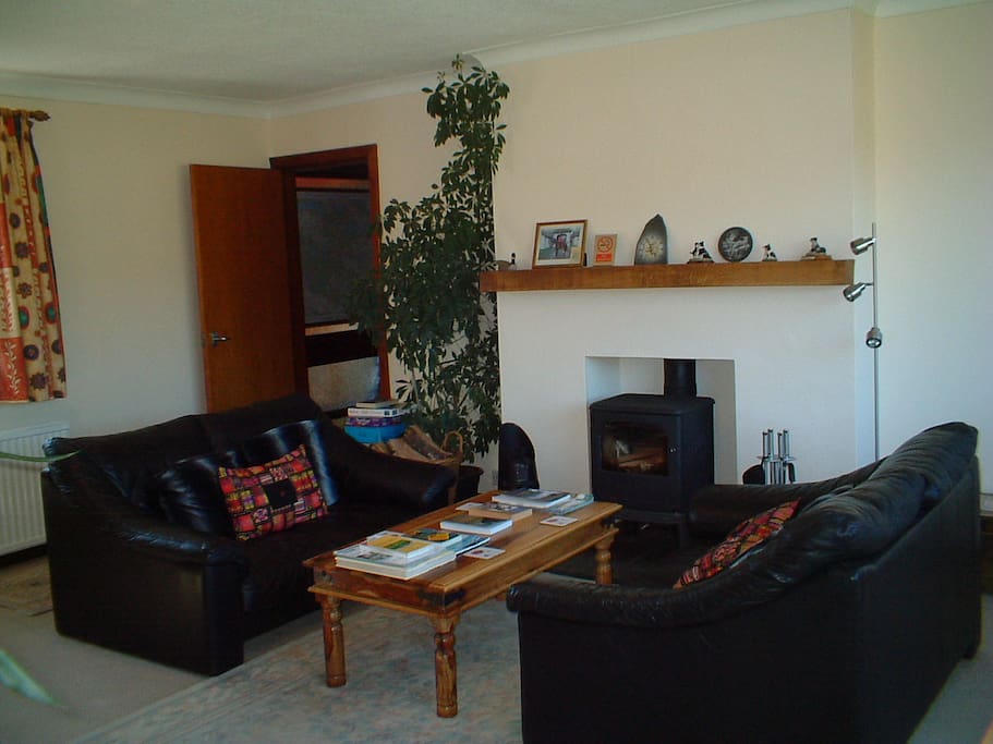 Guests lounge with cosy log burner for the cooler months